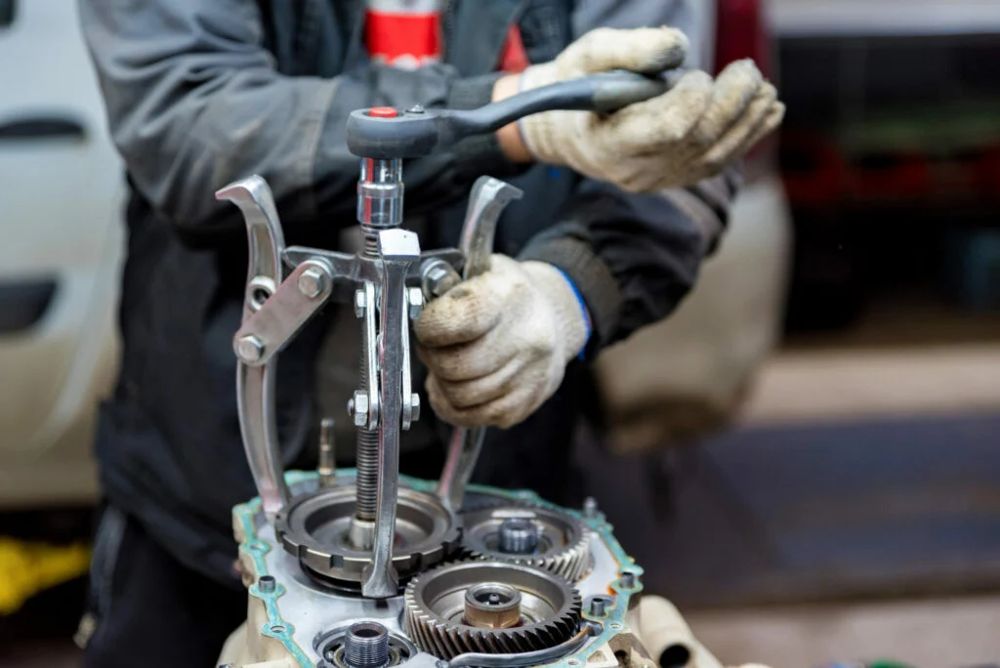 Technician rebuilding a vehicle transmission in Norfolk, VA